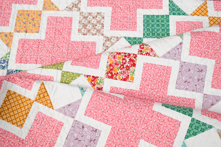 The Tabitha Quilt Pattern in Bee Vintage by Lori Holt for Riley Blake Fabrics. A fun, vintage quilt that is layer cake, fat quarter, or fat eighth friendly.